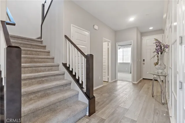 a view of an entryway with wooden floor