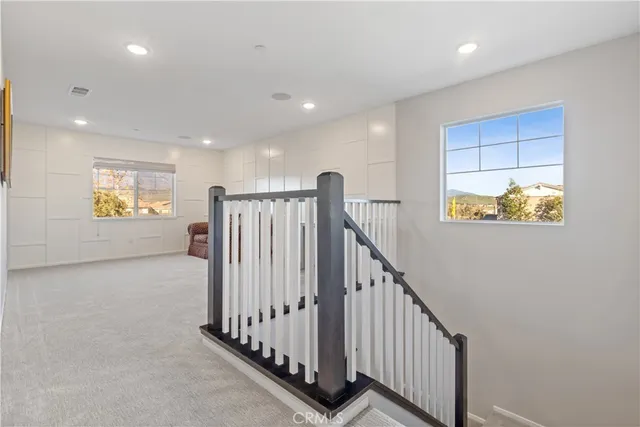 a view of entryway with stairs and a window