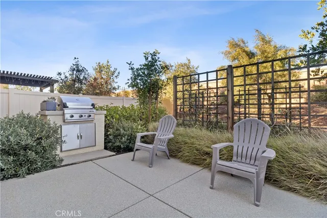 a view of a chairs and table in the patio