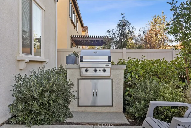 a view of a balcony with stove and refrigerator