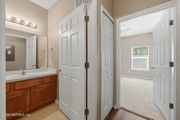 a bathroom with a double vanity sink and mirror