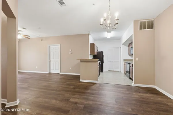 a view of a kitchen with a sink and dishwasher in it