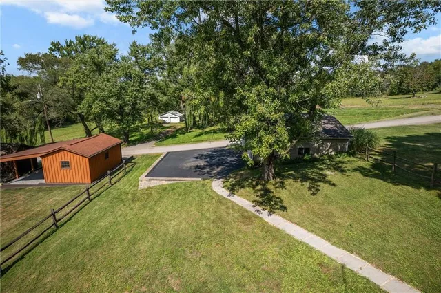 a backyard of a house with lots of green space