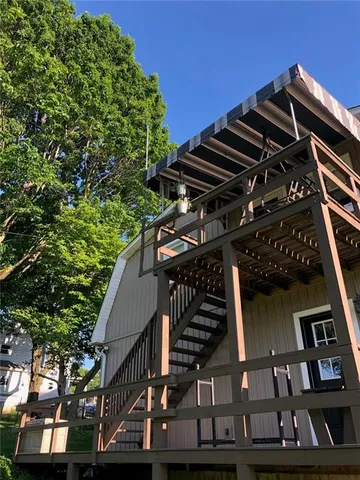 a view of balcony with lots of green space