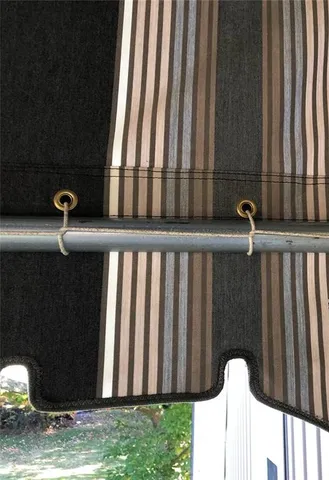 an aerial view of residential houses with outdoor space and parking