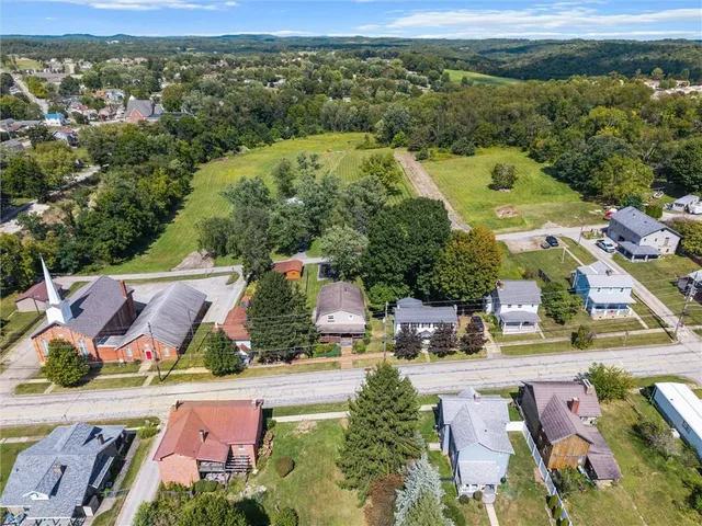 an aerial view of a house with a garden