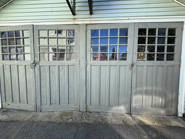 a view of a house with wooden fence