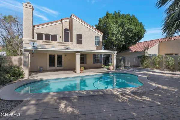a front view of a house with a yard and porch