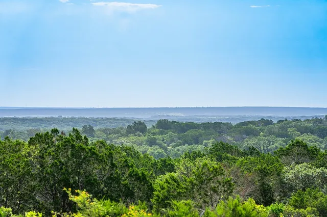 an aerial view of residential houses and outdoor space
