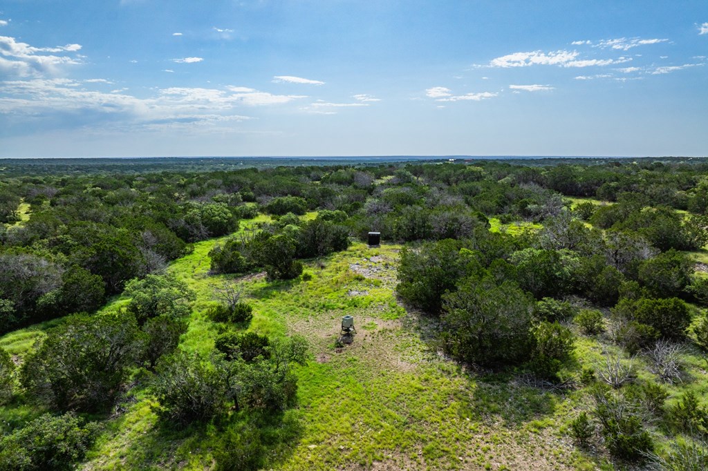230 Camino Real Road Northwest Junction, TX 76849 - Photo 7 of 26 an aerial view of a houses with a yard