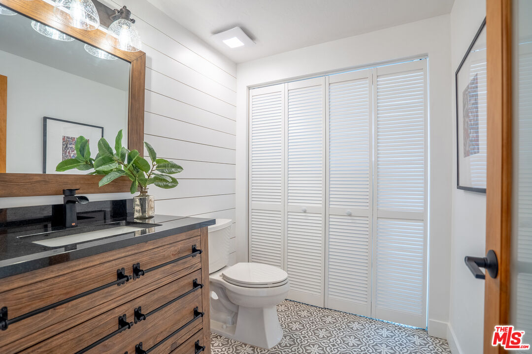 13214 Fiji Way, Unit T Marina del Rey, CA 90292 - Photo 14 of 31 a bathroom with a toilet a sink and a mirror