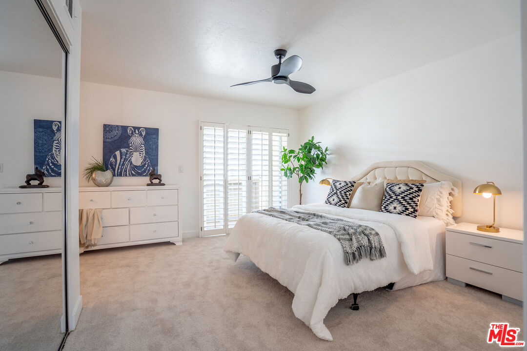 13214 Fiji Way, Unit T Marina del Rey, CA 90292 - Photo 15 of 31 a spacious bedroom with a bed and a cabinets