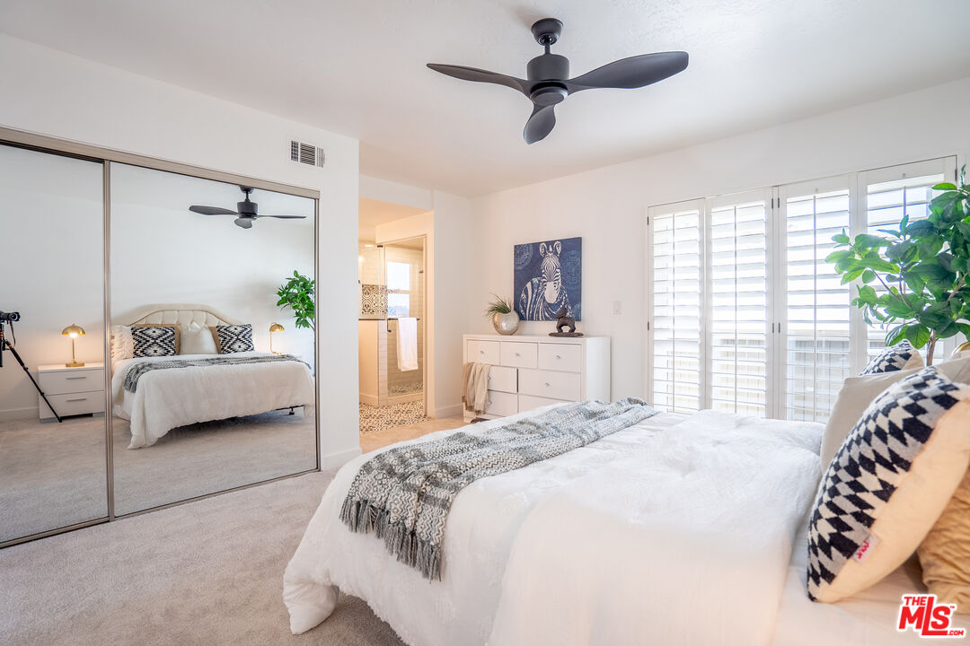 13214 Fiji Way, Unit T Marina del Rey, CA 90292 - Photo 17 of 31 a bedroom with a bed and a couch