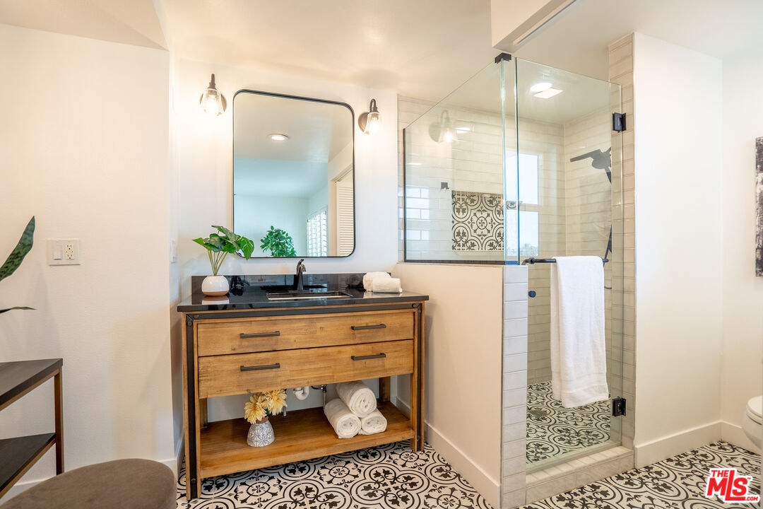 13214 Fiji Way, Unit T Marina del Rey, CA 90292 - Photo 19 of 31 a bathroom with a sink a toilet and shower