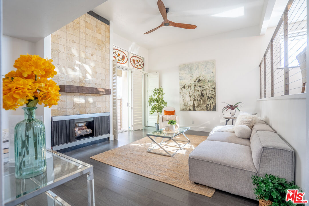 13214 Fiji Way, Unit T Marina del Rey, CA 90292 - Photo 2 of 31 a living room with furniture and a fireplace