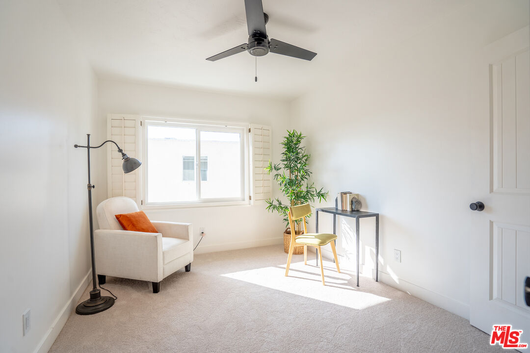 13214 Fiji Way, Unit T Marina del Rey, CA 90292 - Photo 23 of 31 a living room with furniture and a potted plant