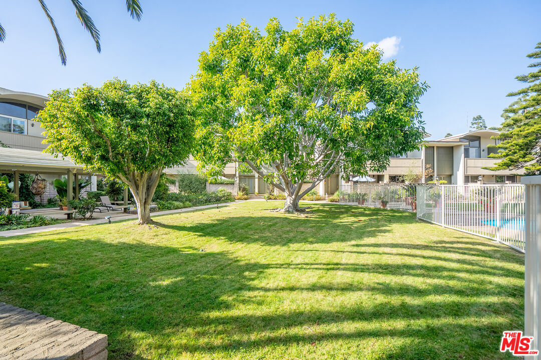 13214 Fiji Way, Unit T Marina del Rey, CA 90292 - Photo 27 of 31 a swimming pool with outdoor seating and yard