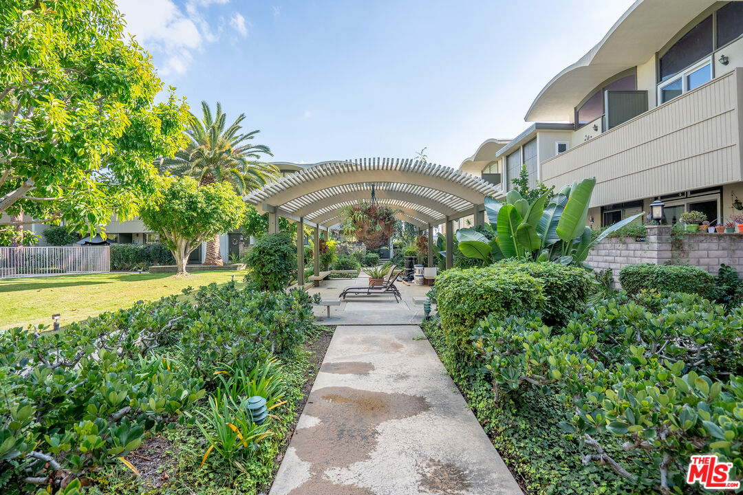 13214 Fiji Way, Unit T Marina del Rey, CA 90292 - Photo 29 of 31 a view of a swimming pool with a garden
