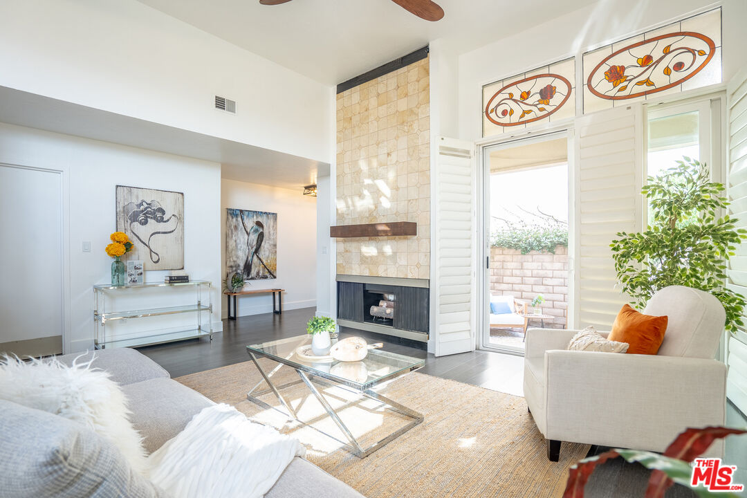 13214 Fiji Way, Unit T Marina del Rey, CA 90292 - Photo 3 of 31 a living room with furniture and a fireplace