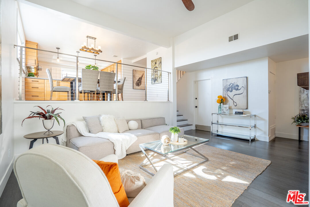 13214 Fiji Way, Unit T Marina del Rey, CA 90292 - Photo 4 of 31 a living room with furniture and wooden floor