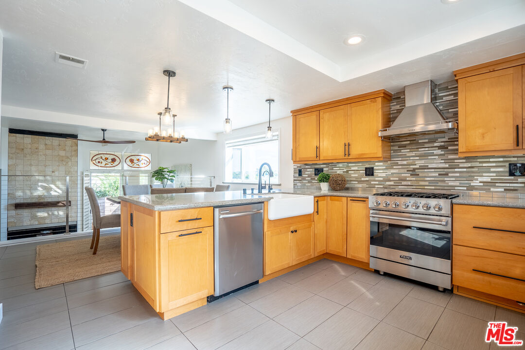 13214 Fiji Way, Unit T Marina del Rey, CA 90292 - Photo 8 of 31 a kitchen with stainless steel appliances granite countertop a stove a sink and a refrigerator