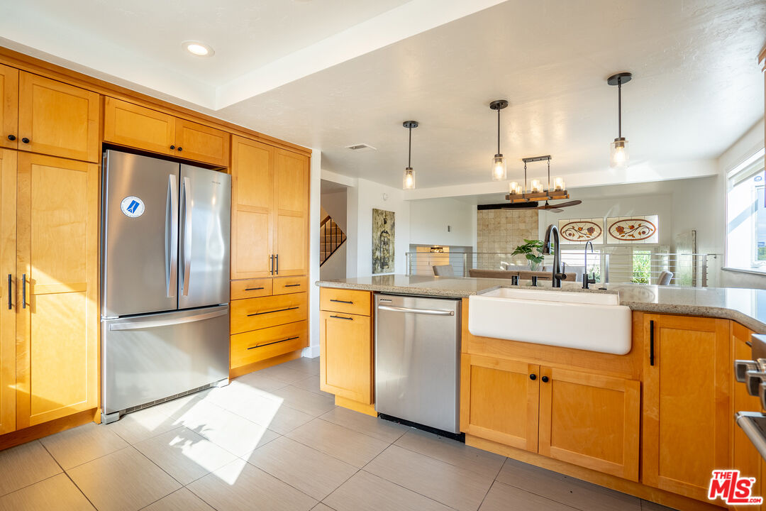 13214 Fiji Way, Unit T Marina del Rey, CA 90292 - Photo 9 of 31 a kitchen with stainless steel appliances granite countertop a refrigerator a oven and a sink