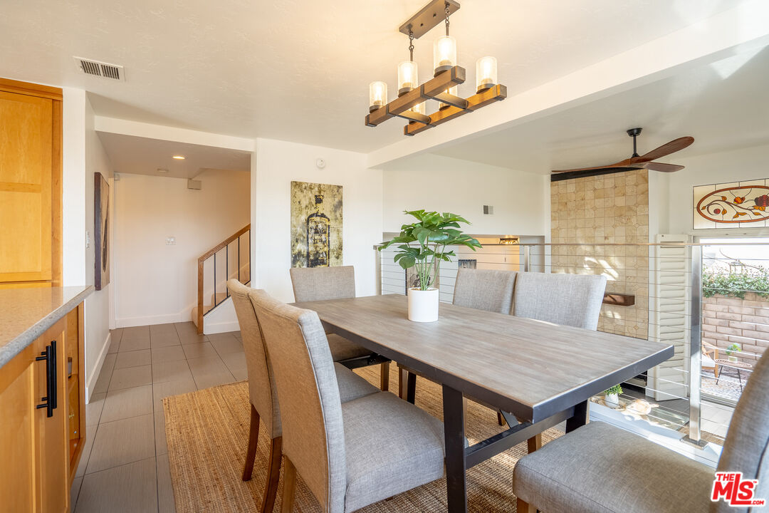 13214 Fiji Way, Unit T Marina del Rey, CA 90292 - Photo 10 of 31 a view of a dining room with furniture and wooden floor