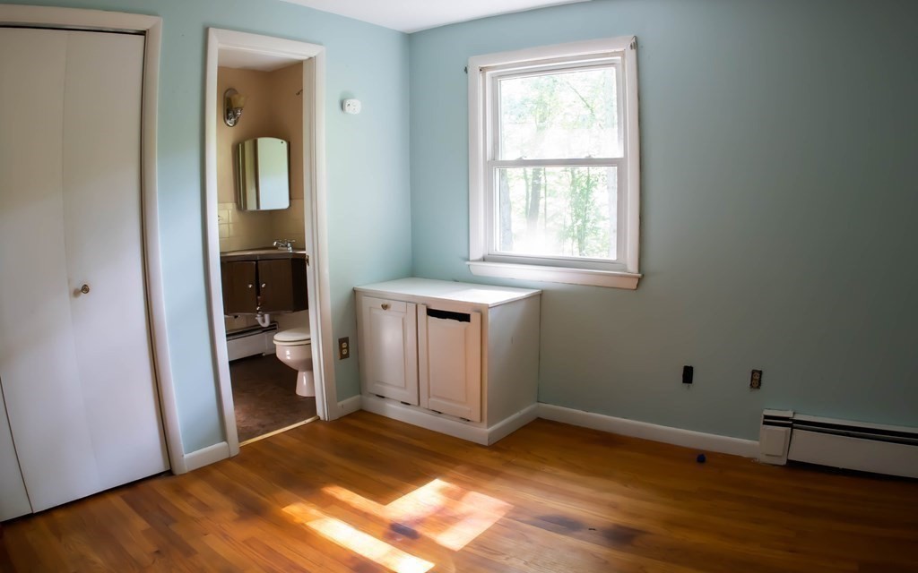 47 Craig Street Springfield, MA 01108 - Photo 12 of 18 a view of empty room with wooden floor and fan