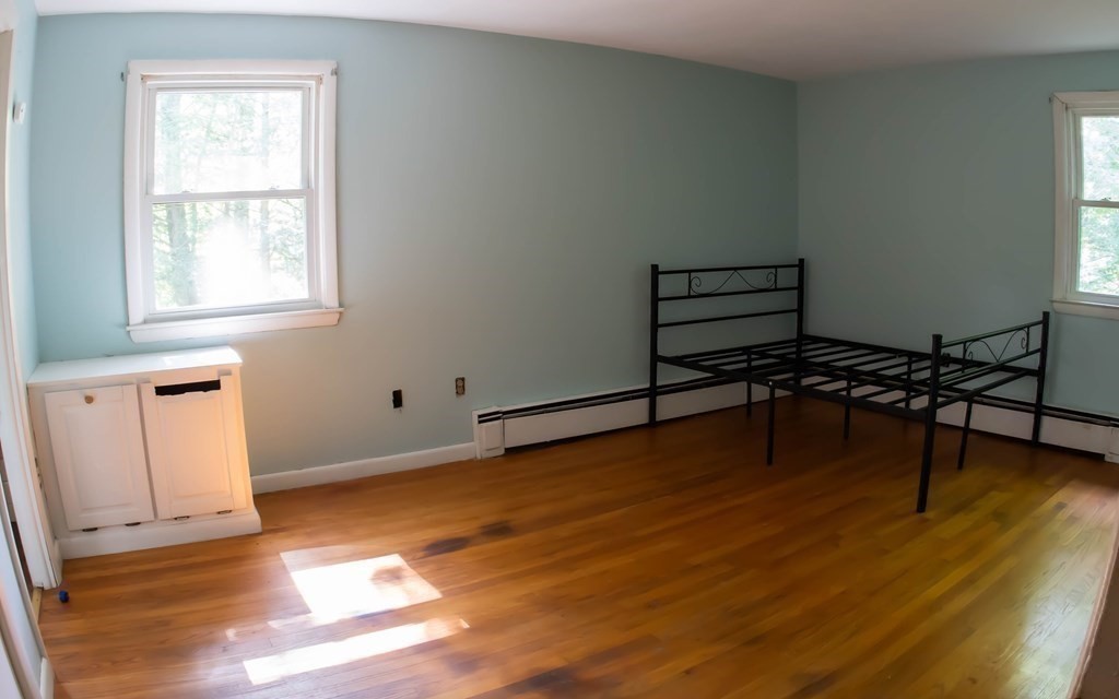 47 Craig Street Springfield, MA 01108 - Photo 13 of 18 a living room with hard wood floors and a window