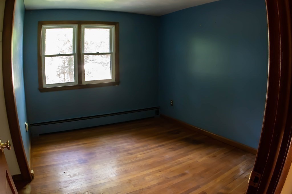47 Craig Street Springfield, MA 01108 - Photo 14 of 18 a view of a room with wooden floor and a window