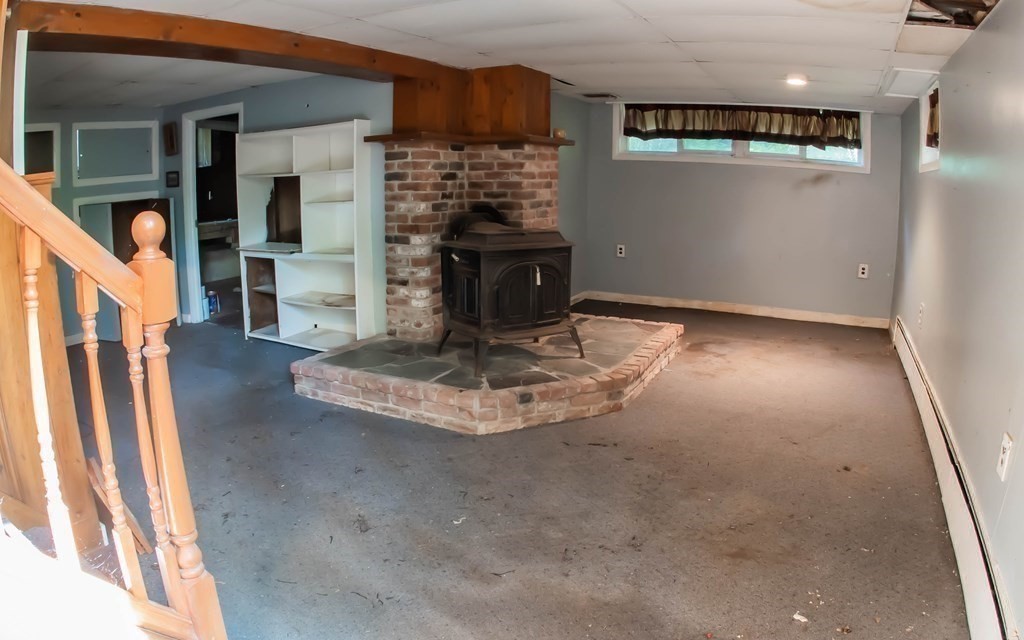 47 Craig Street Springfield, MA 01108 - Photo 6 of 18 a view of a livingroom with a fireplace
