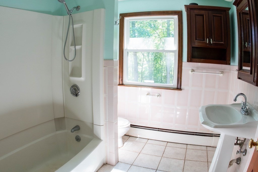 47 Craig Street Springfield, MA 01108 - Photo 10 of 18 a bathroom with a sink and a shower