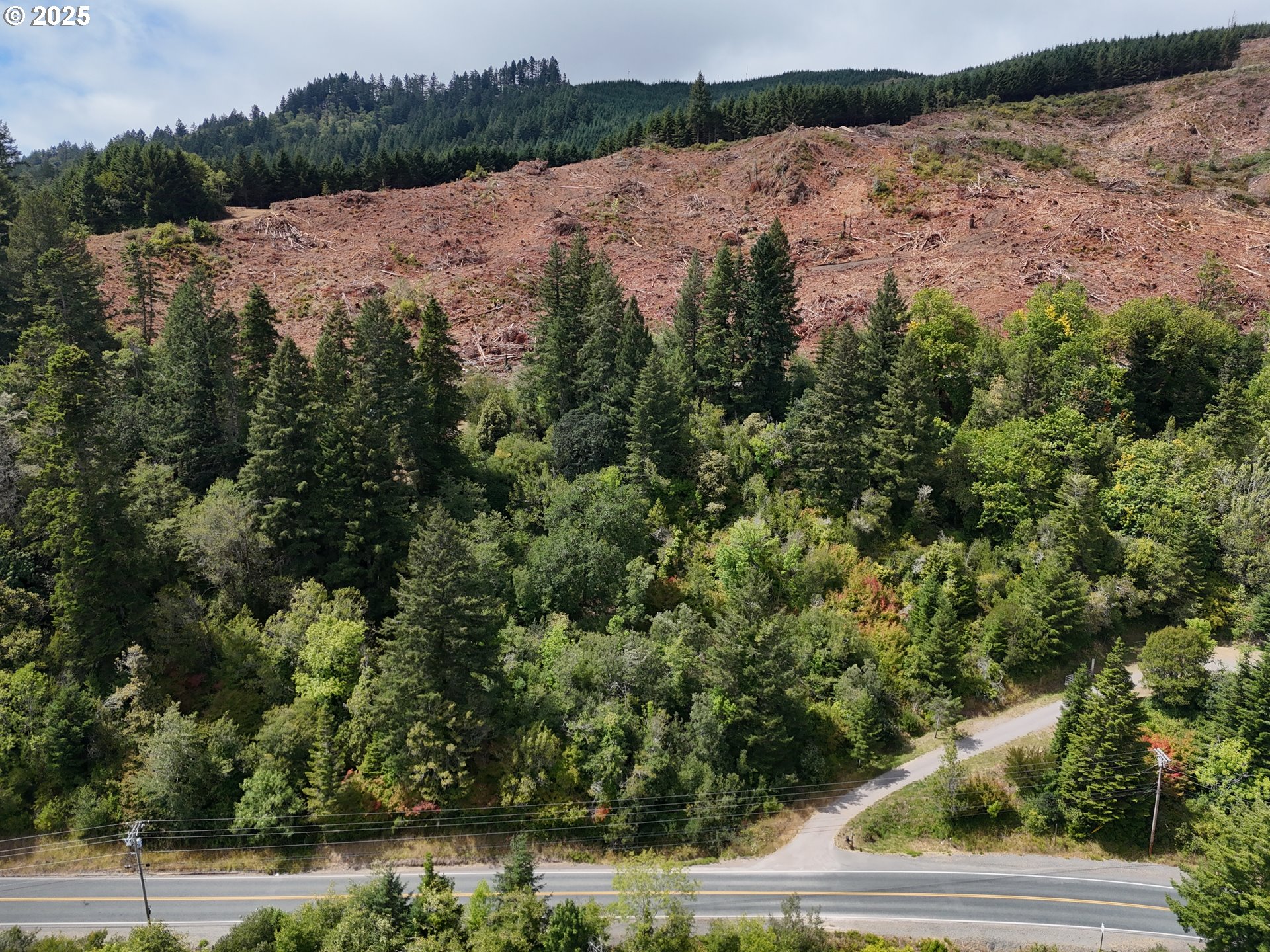 0 North Bank Chetco Brookings, OR 97415 - Photo 2 of 8 a view of a lake with mountain in the background