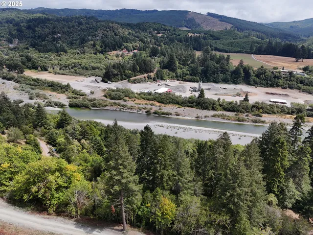 a view of a town with mountains in the background