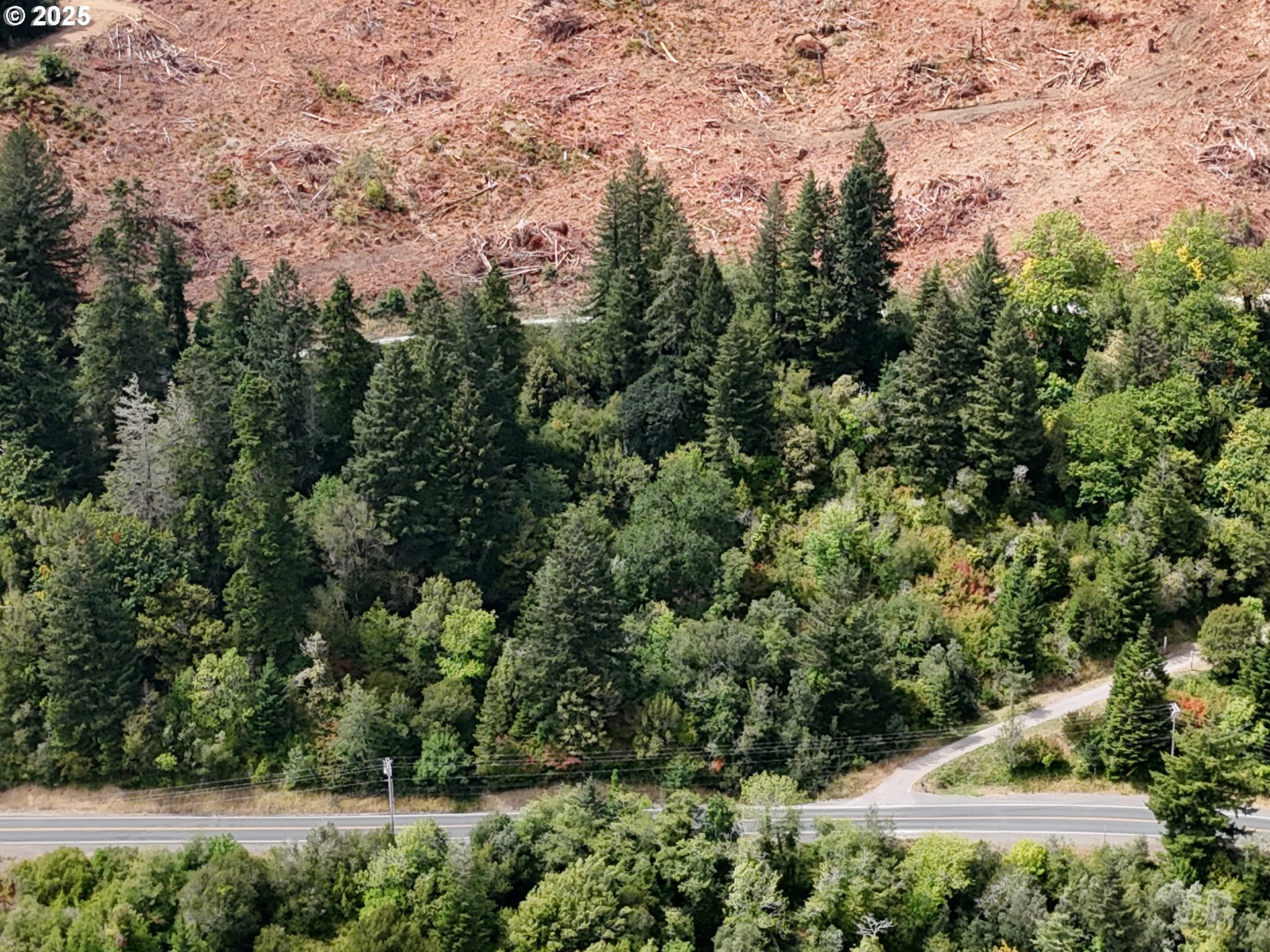 0 North Bank Chetco Brookings, OR 97415 - Photo 7 of 8 an aerial view of a house with yard