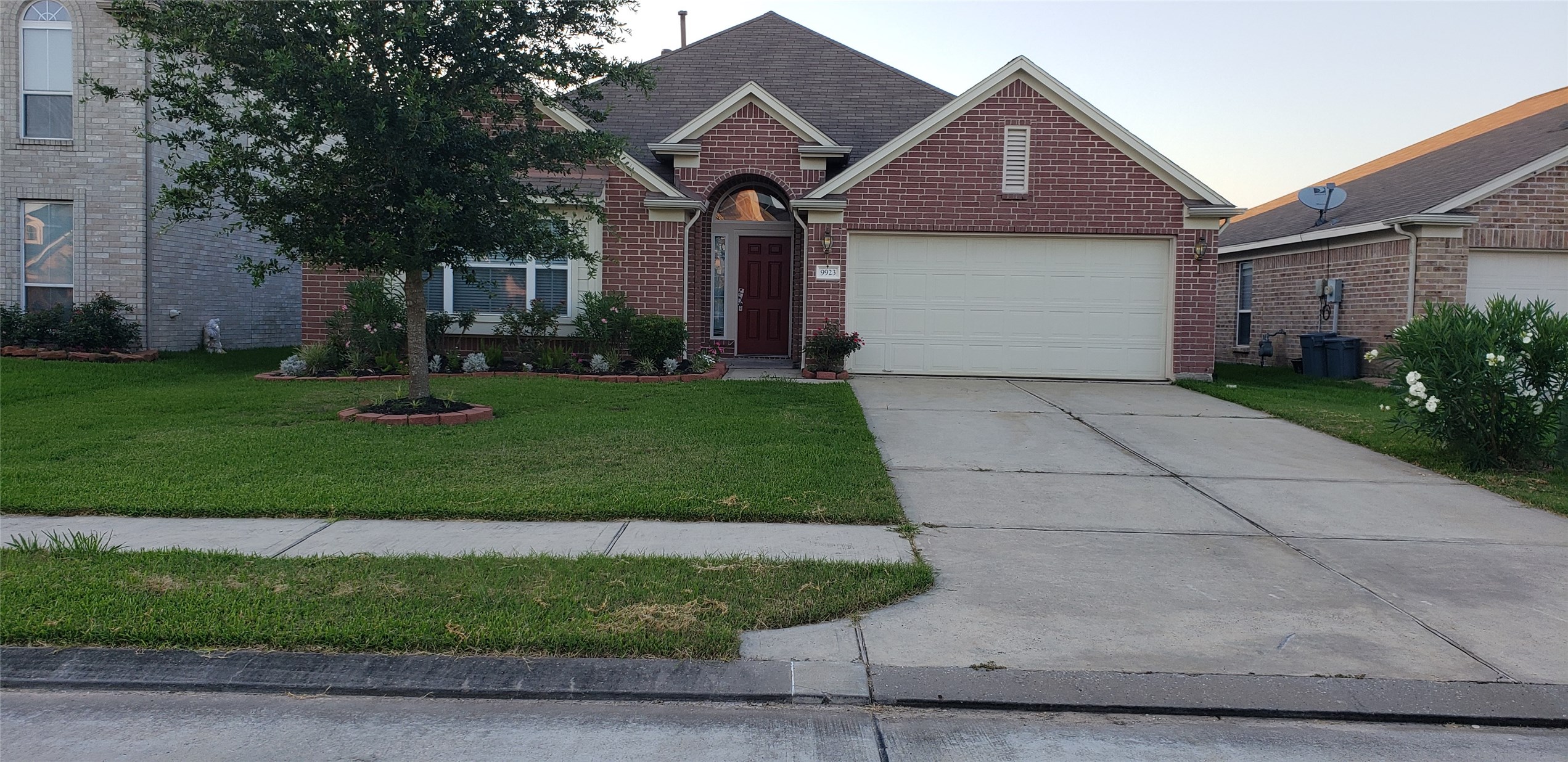 9923 Yearling Place Conroe, TX 77385 - Photo 33 of 36 a front view of a house with a yard and garage
