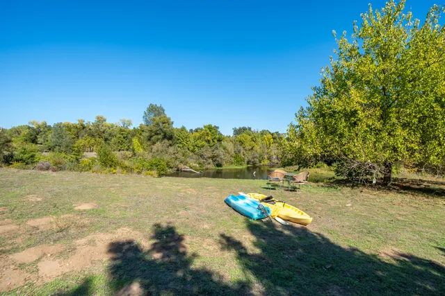 an aerial view of house with yard swimming pool and outdoor seating