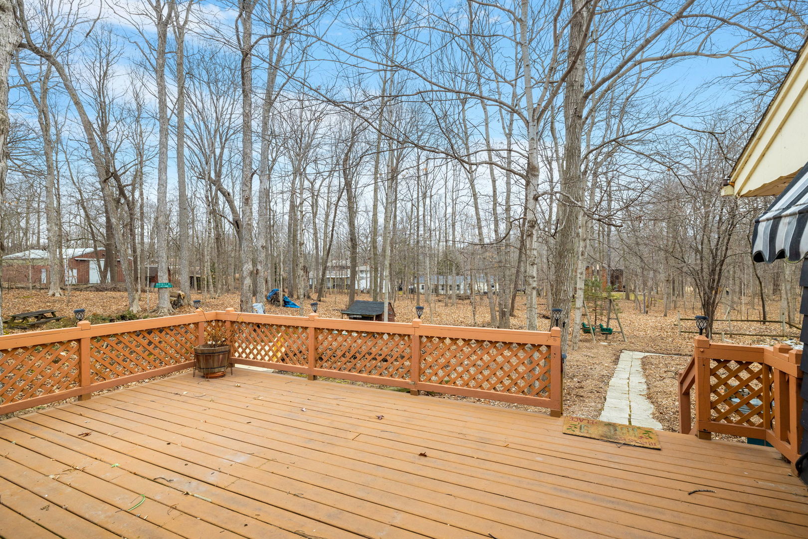 11040 Cleveland Road Mokena, IL 60448 - Photo 12 of 28 a view of a roof deck with couches and wooden fence