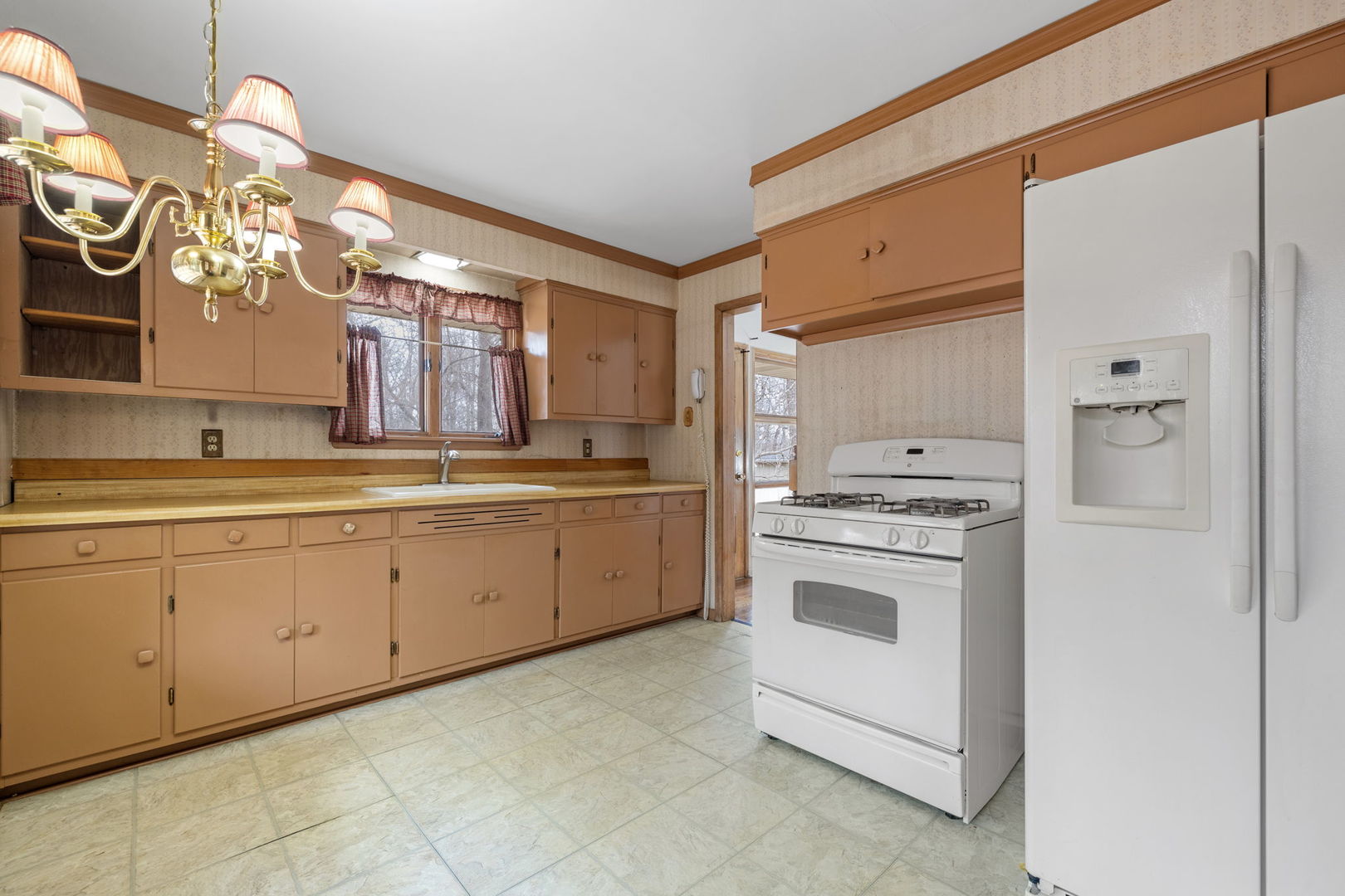11040 Cleveland Road Mokena, IL 60448 - Photo 14 of 28 a kitchen with cabinets appliances and a window