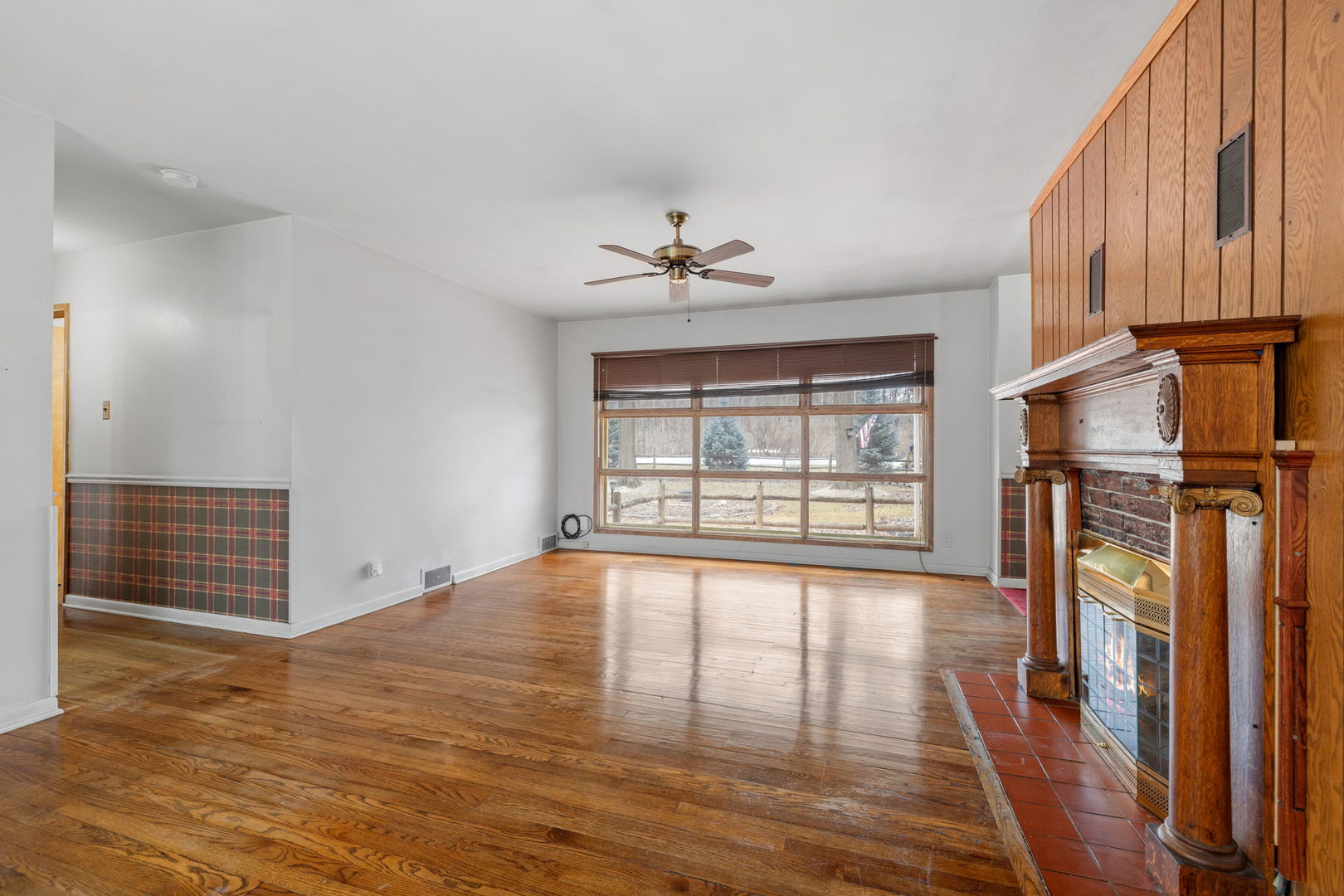 11040 Cleveland Road Mokena, IL 60448 - Photo 18 of 28 a view of an empty room with window and wooden floor