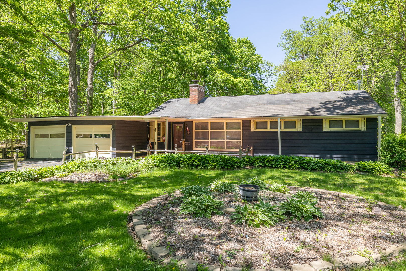 11040 Cleveland Road Mokena, IL 60448 - Photo 3 of 28 a front view of a house with a garden