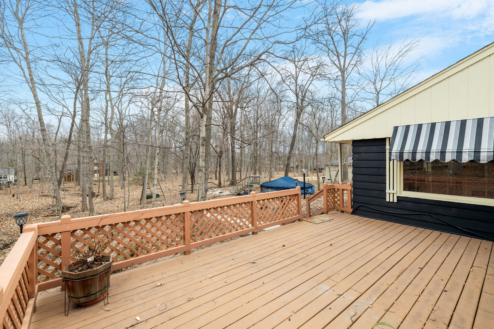 11040 Cleveland Road Mokena, IL 60448 - Photo 8 of 28 a view of a deck with wooden floor and fence