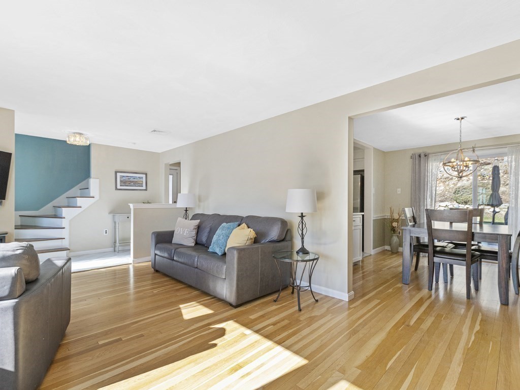 223 Hardy Pond Road Waltham, MA 02451 - Photo 13 of 38 a living room with furniture and a wooden floor