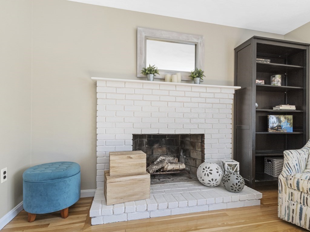 223 Hardy Pond Road Waltham, MA 02451 - Photo 14 of 38 a living room with furniture and a fireplace