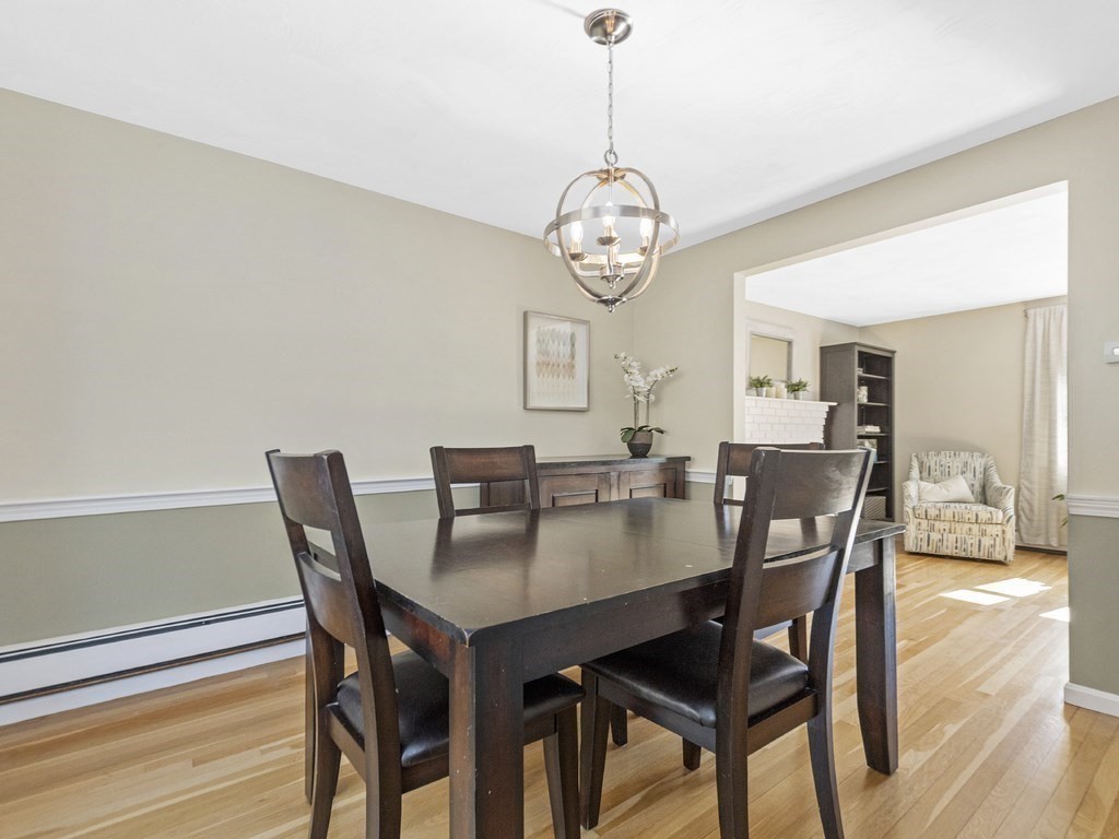 223 Hardy Pond Road Waltham, MA 02451 - Photo 17 of 38 a view of a dining room with furniture window and wooden floor
