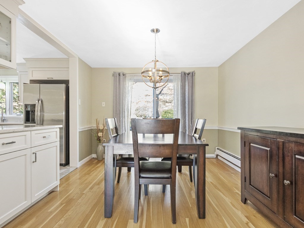 223 Hardy Pond Road Waltham, MA 02451 - Photo 18 of 38 a view of a dining room with furniture window and wooden floor