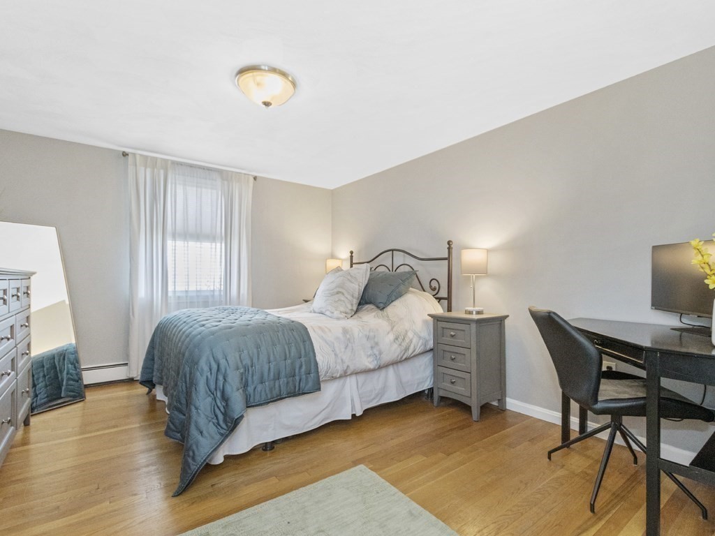 223 Hardy Pond Road Waltham, MA 02451 - Photo 22 of 38 a bedroom with a bed and a desk