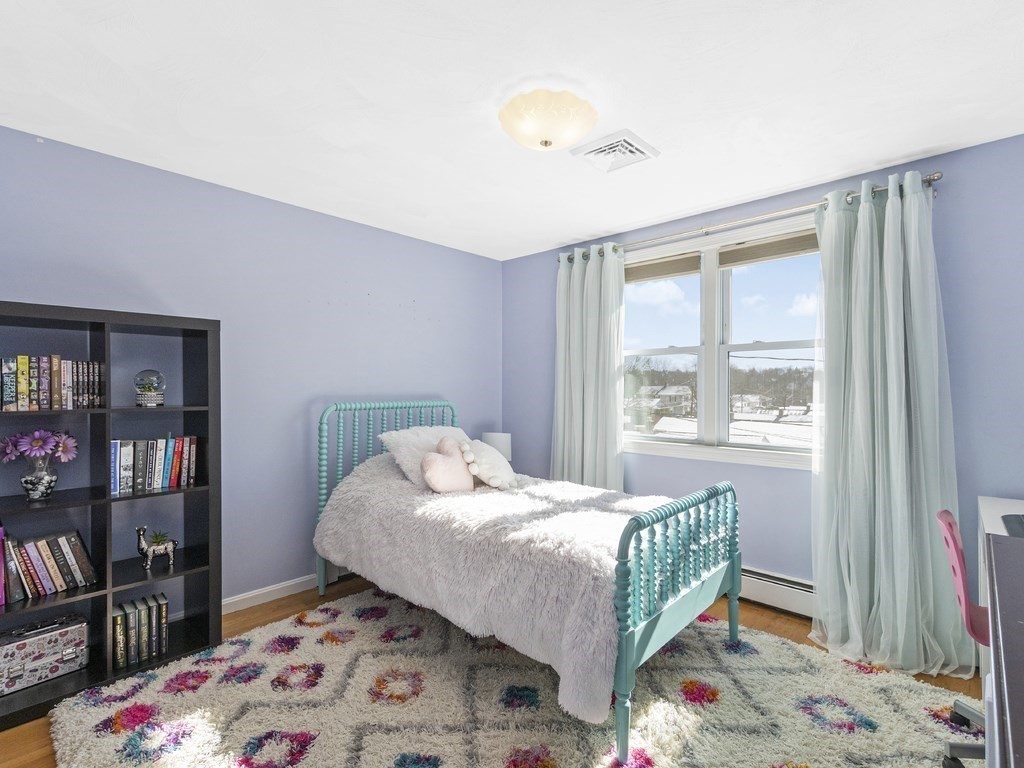 223 Hardy Pond Road Waltham, MA 02451 - Photo 26 of 38 a bedroom with a bed and a window