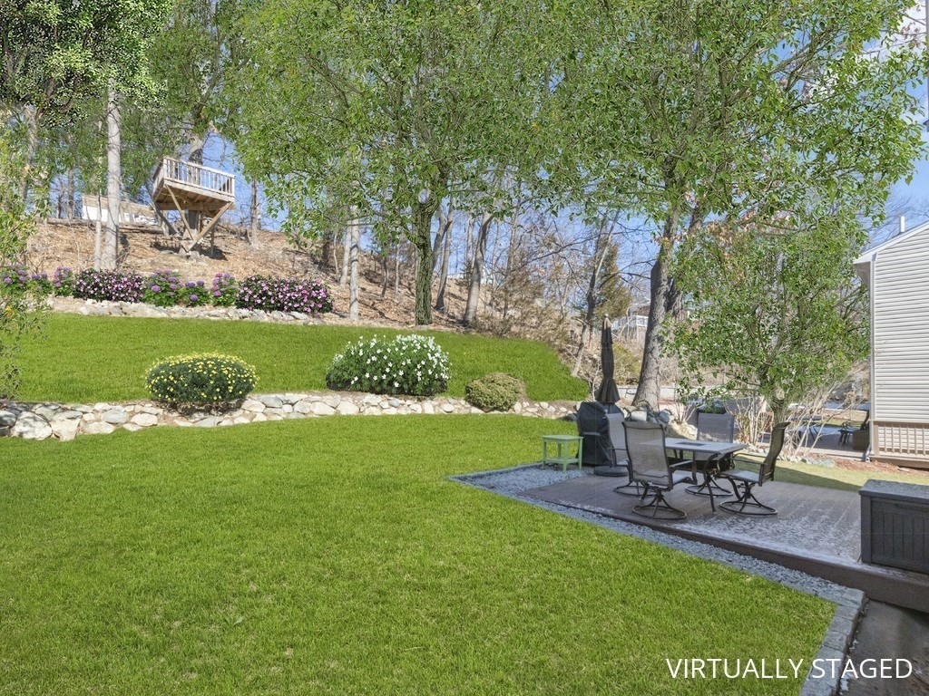223 Hardy Pond Road Waltham, MA 02451 - Photo 35 of 38 a view of a backyard with sitting area