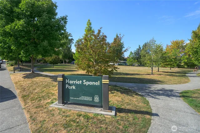 a view of a water fountain with wooden fence